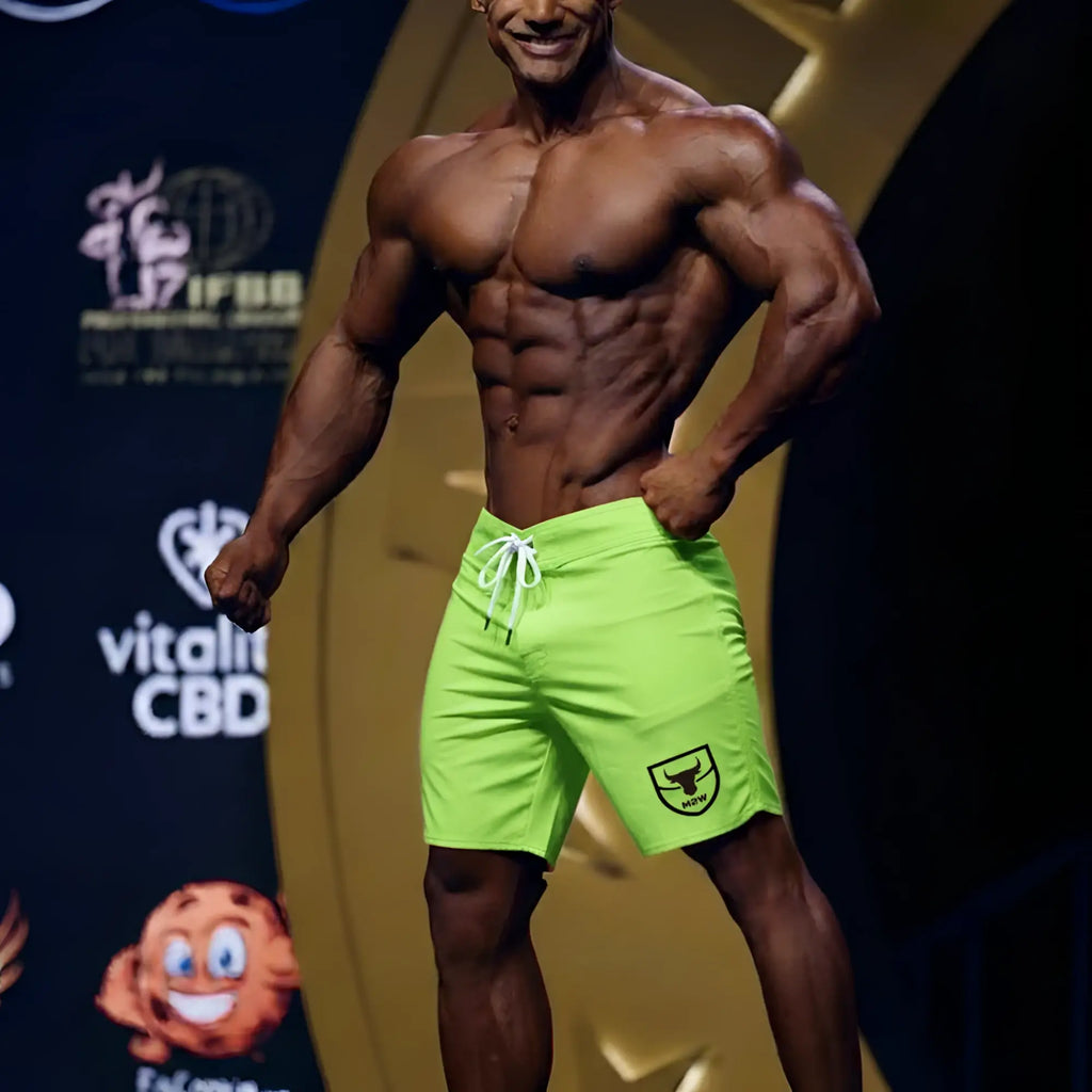 Metro malewear physique board short neon green with white drawstring and black shield logo on lower right leg