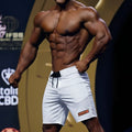 MetroMaleWear Physique board short white with black drawstring and small orange logo on lower right leg