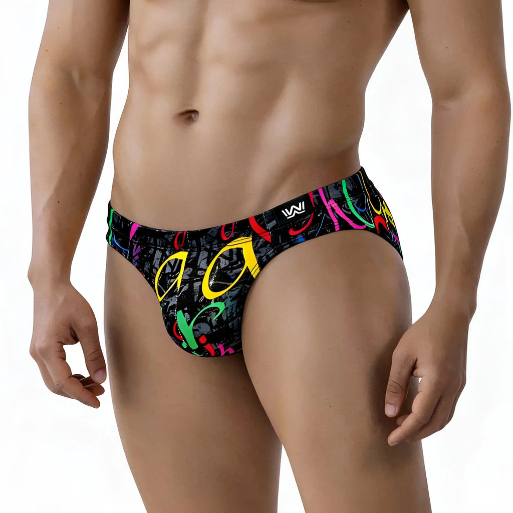 Black swim trunks by metromalewear with vibrant graffiti style neon pink yellow green and red lettering design