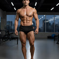 Black athletic briefs metroMalewear classic bodybuilding trunk 6 inch worn by muscular man in gym setting