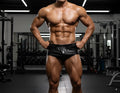 Black shiny leather gym shorts metroMalewear classic bodybuilding trunk 6 inch length front view