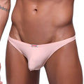 Pink men’s pouch thong by metromalewear in dusty pink with a small red and white brand tag at the waistband