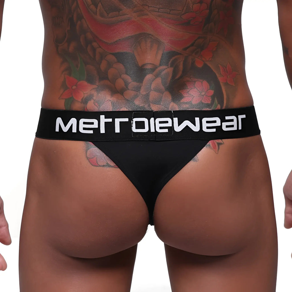 Black MetroMaleWear Prieto thong with white logo waistband showing front side for comfortable metrowear use