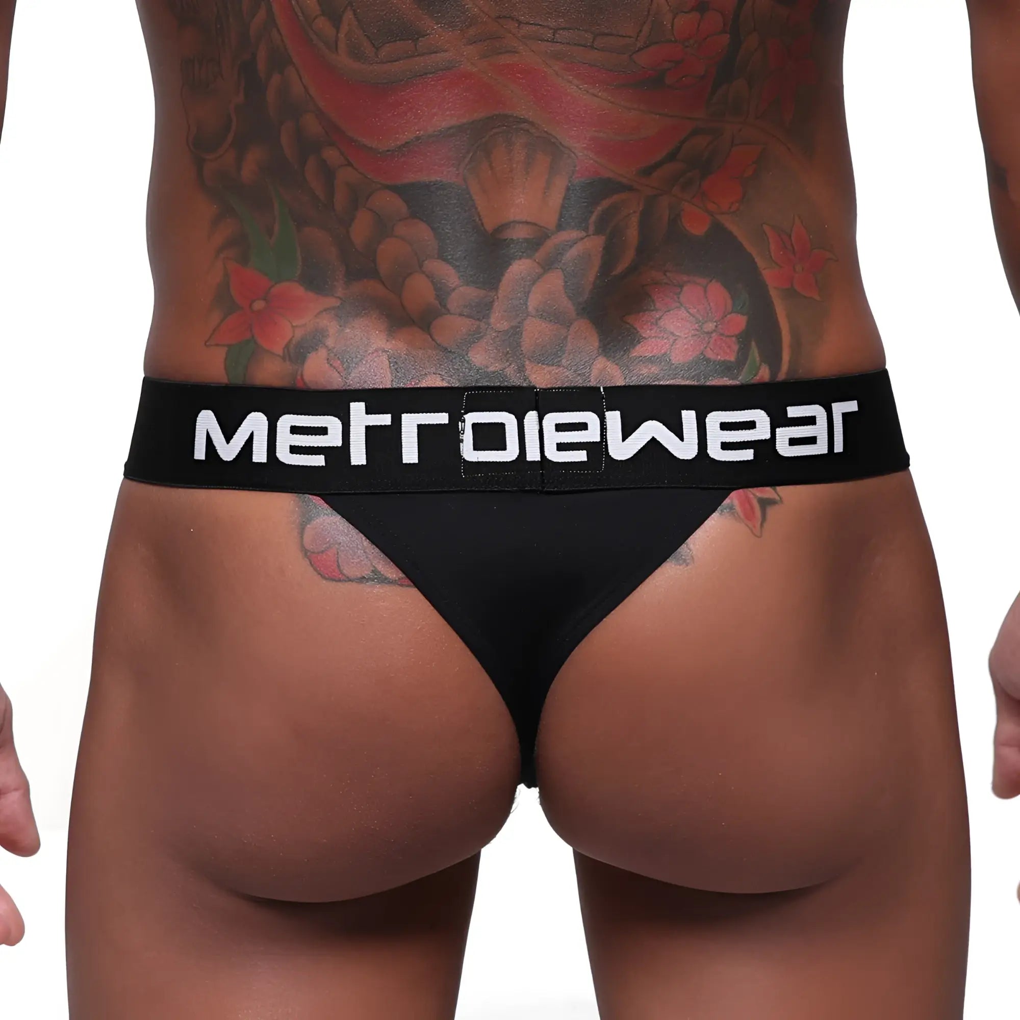 Black MetroMaleWear Prieto thong with white logo waistband showing front side for comfortable metrowear use