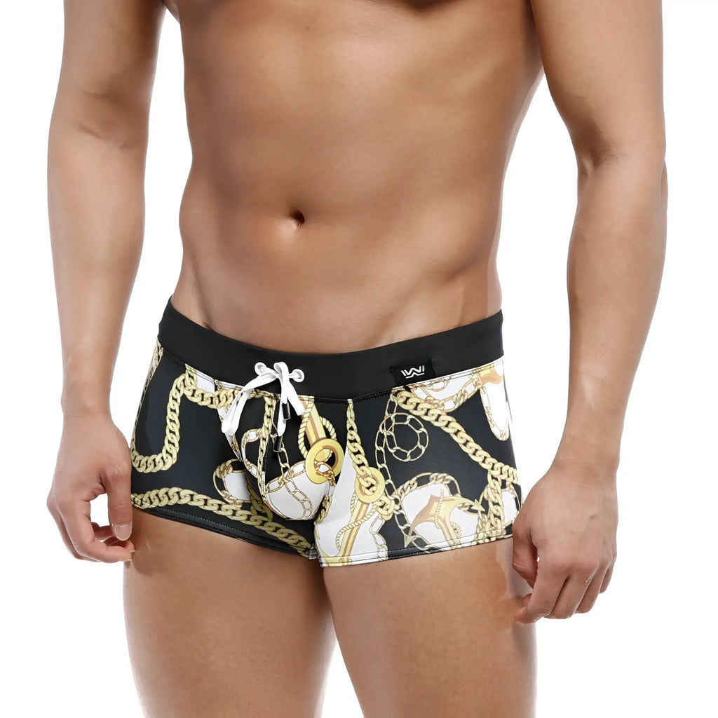 Black swim boxer briefs with bold gold and white chain pattern and contrasting waistband by MetroMaleWear Profundo
