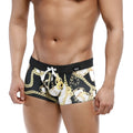 Black swim boxer briefs with bold gold and white chain pattern and contrasting waistband by MetroMaleWear Profundo