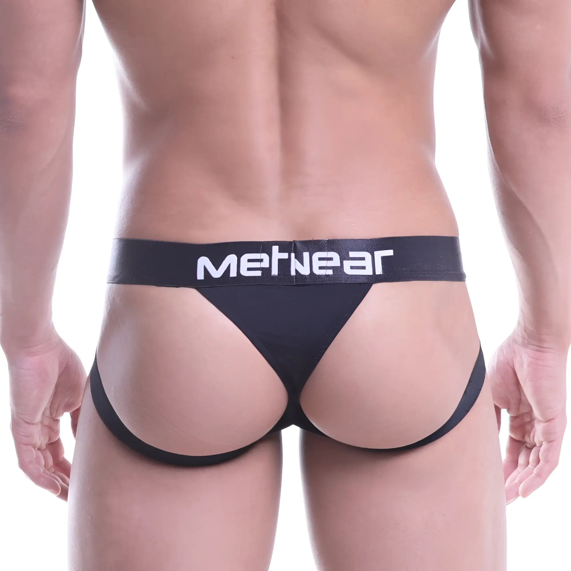Black metnear brand sports jock thong with white lettering on waistband for activewear use