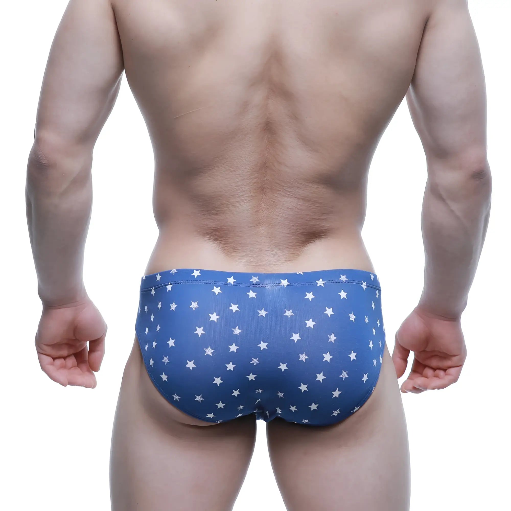 Blue swim trunks by Metromalewear featuring a white star pattern in the Stella Hip Brief 5123-90 style