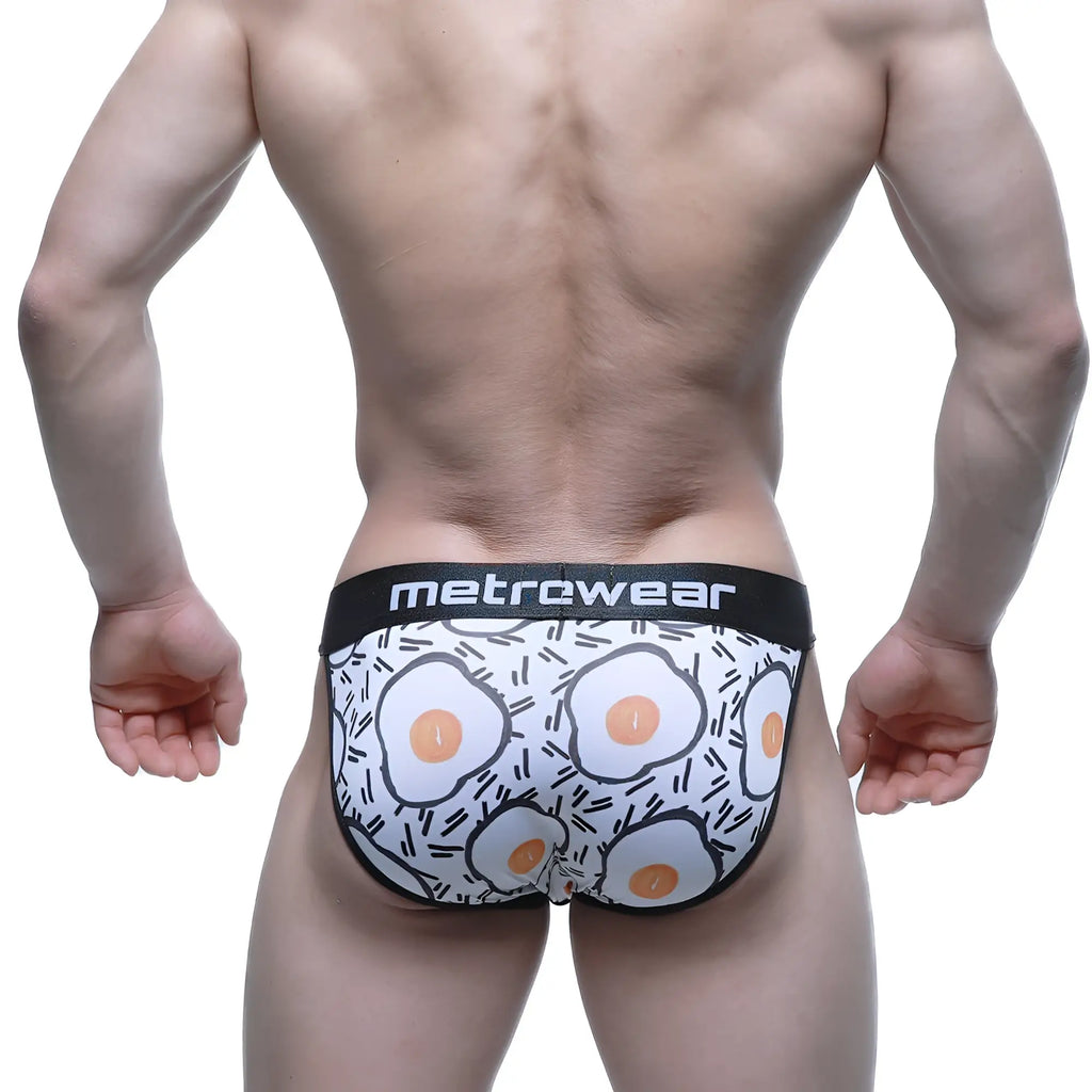 White men’s briefs with playful fried egg pattern and black trim by metrcwear metro male wear sunny side bikini 3004-55