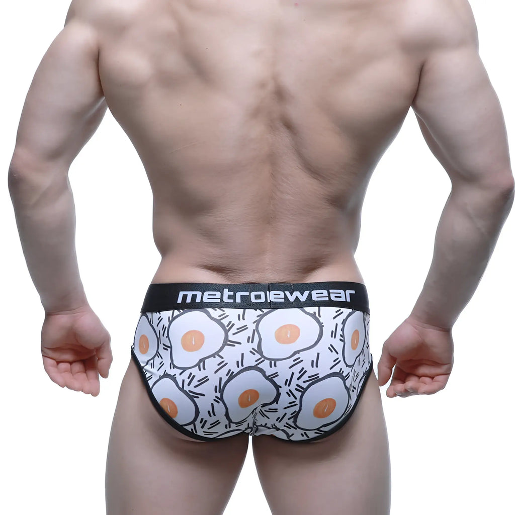 White metroewear briefs with orange and black cartoon fried egg pattern elastic waistband metroMalewear Sunny Side 5203-64
