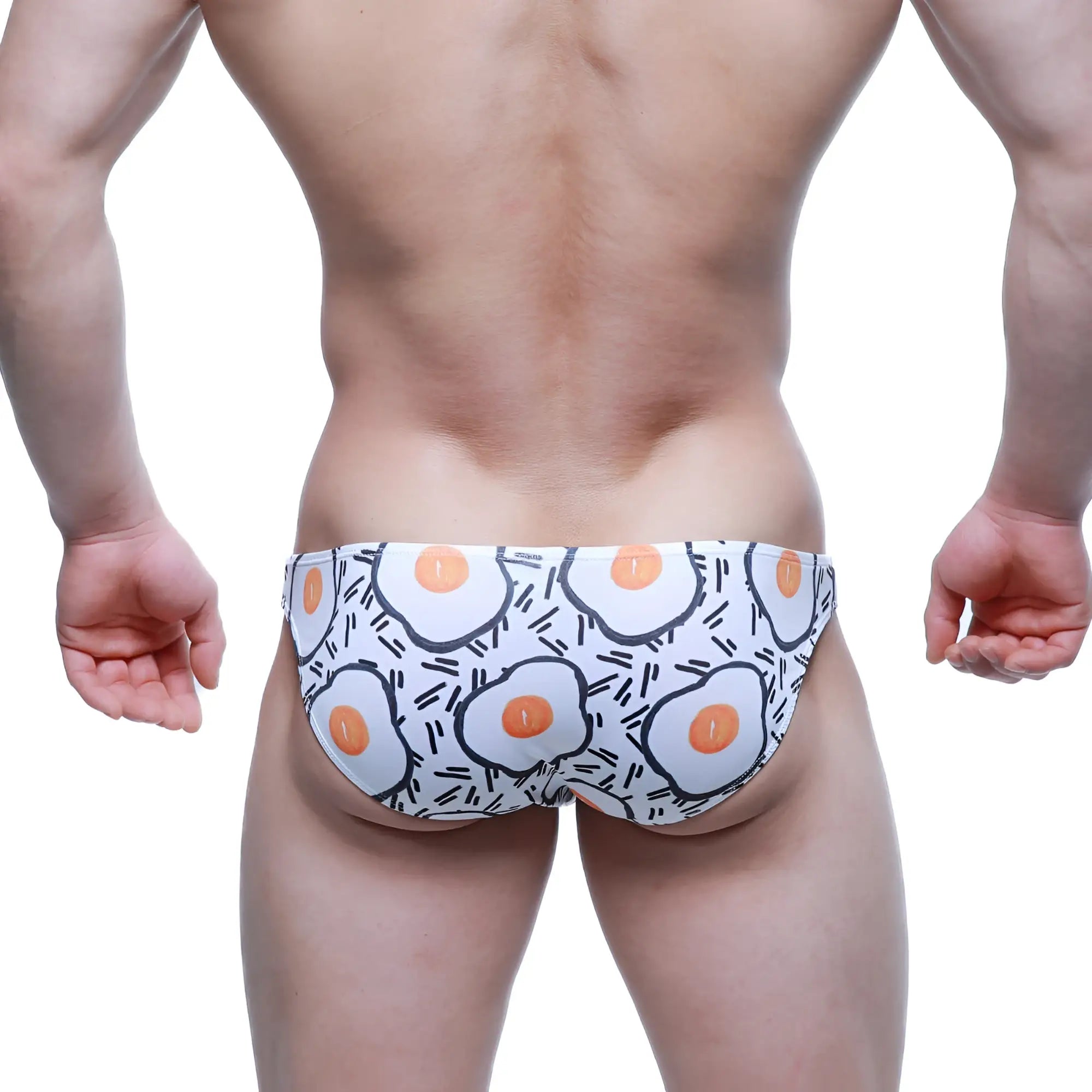 White swim trunks metro malewear sunny side lowrise bikini with cartoon fried egg pattern and black line accents