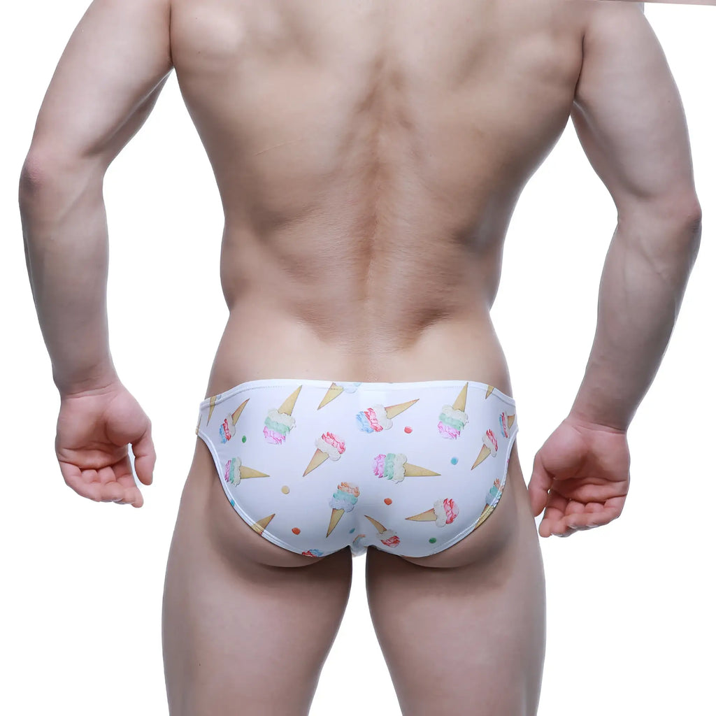 White swim trunks by metromalewear with colorful ice cream cone and sprinkle pattern in super lowrise bikini style