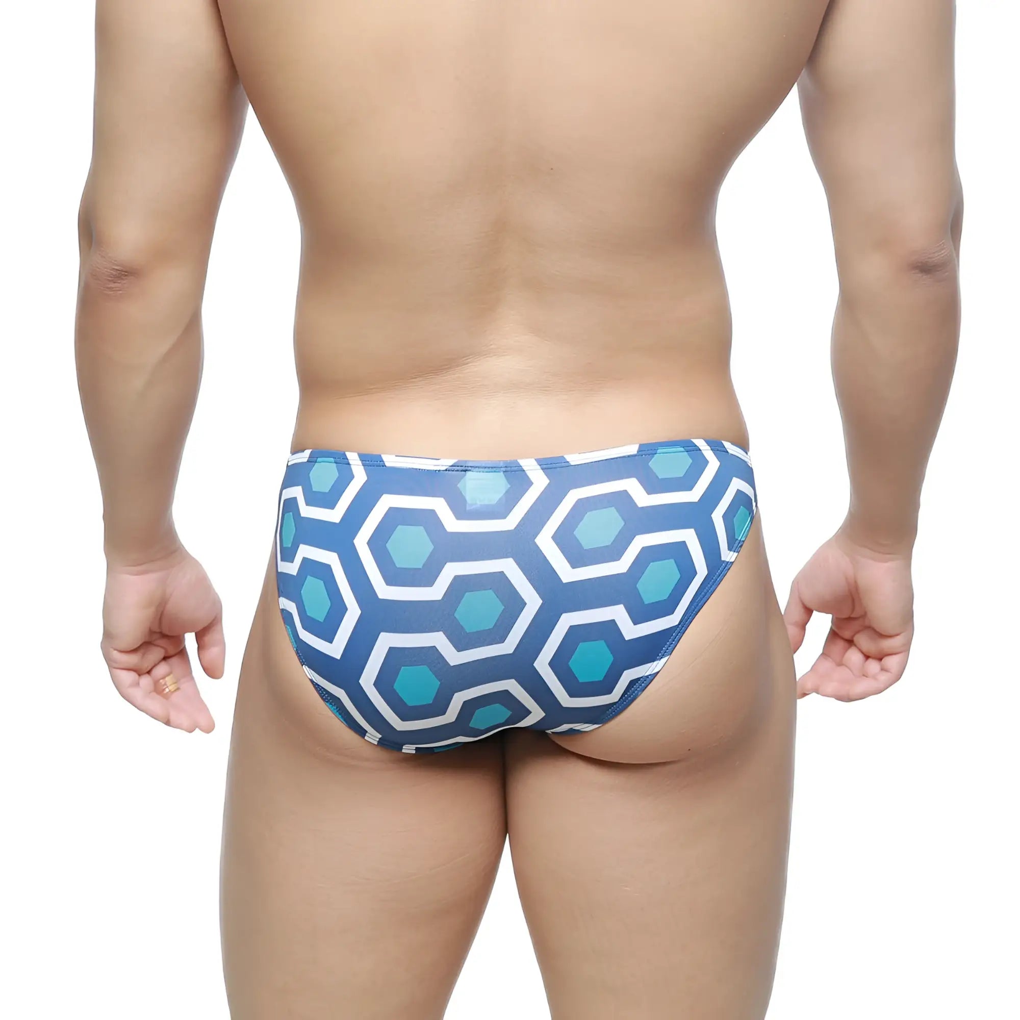 Blue and white geometric patterned swim trunks with a retro hexagonal design by MetroMaleWear super lowrise bikini