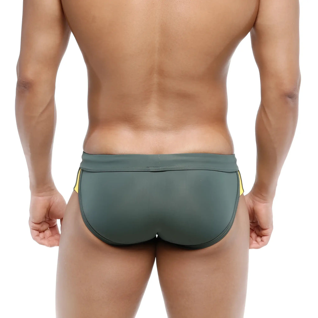 Dark green metro malewear swim briefs with yellow side stripes designed for campus use