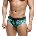 Green tropical leaf-patterned swim trunks with black elastic waistband and drawstring from MetroMaleWear metrobrief line