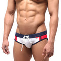 White metroMalewear Tebai swim brief with navy blue and red side stripes and white drawstring waistband