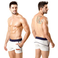 White metro malewear terry sport shorts with navy waistband trim and orange logo on left leg 4701-10