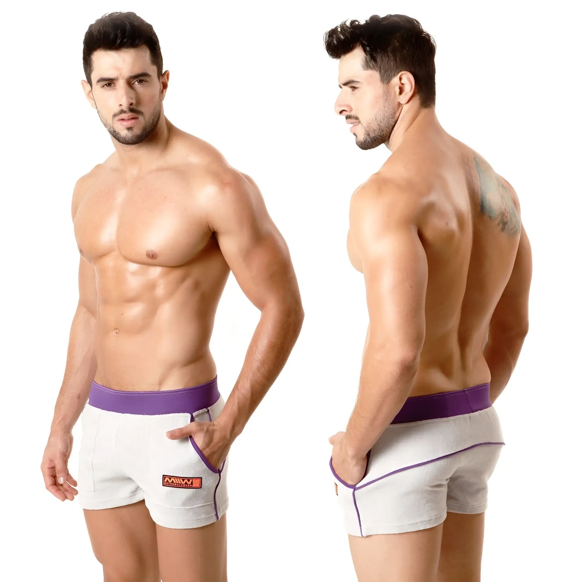 White terry sport shorts by metromalewear with purple waistband trim and orange logo on side