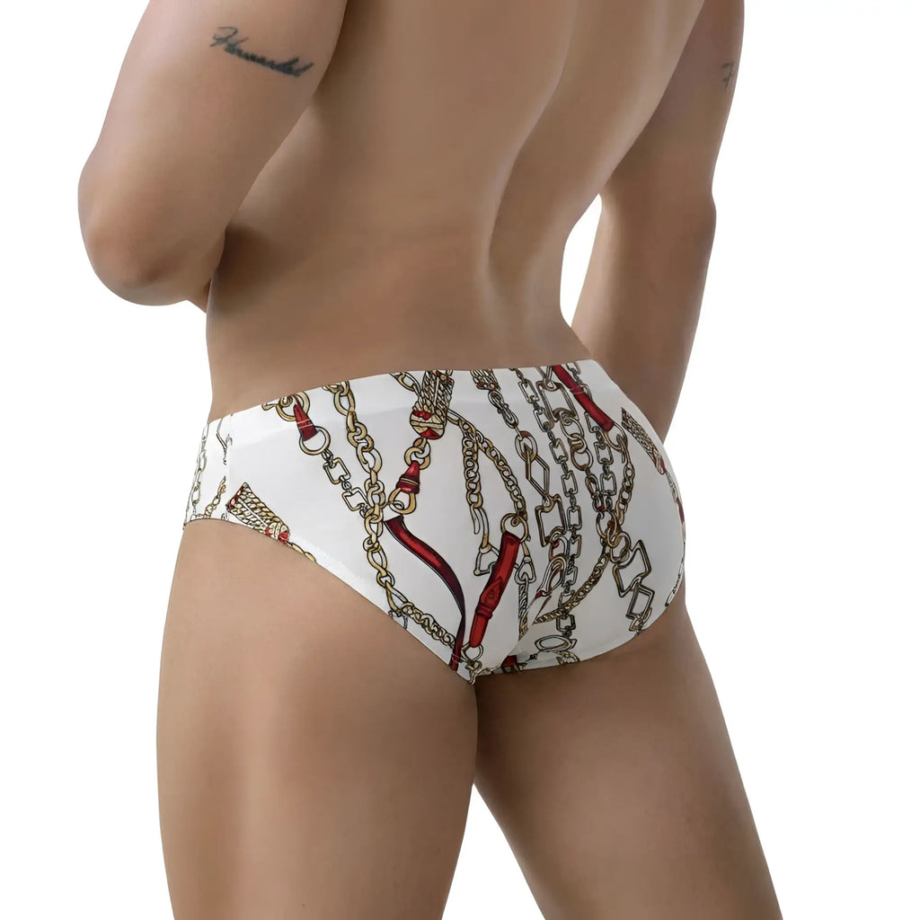White briefs metro malewear tiki bikini 5103-89 with bold gold and red chain pattern on smooth fabric