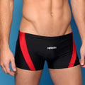 Black metroMalewear ultra square cut swim trunks with bold red side stripes and white aniiiv logo on front