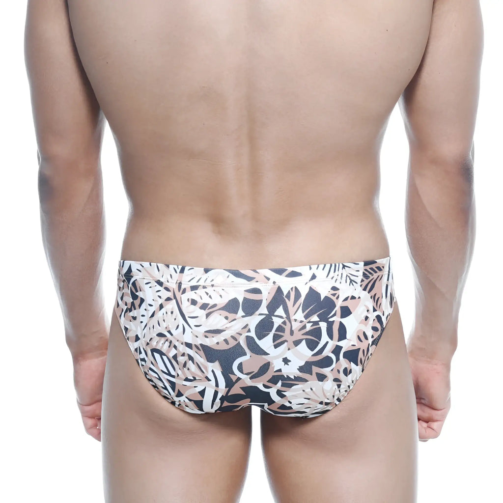 Men’s swim trunks metro malewear vasco hip brief hoja with bold black white and beige tropical leaf pattern