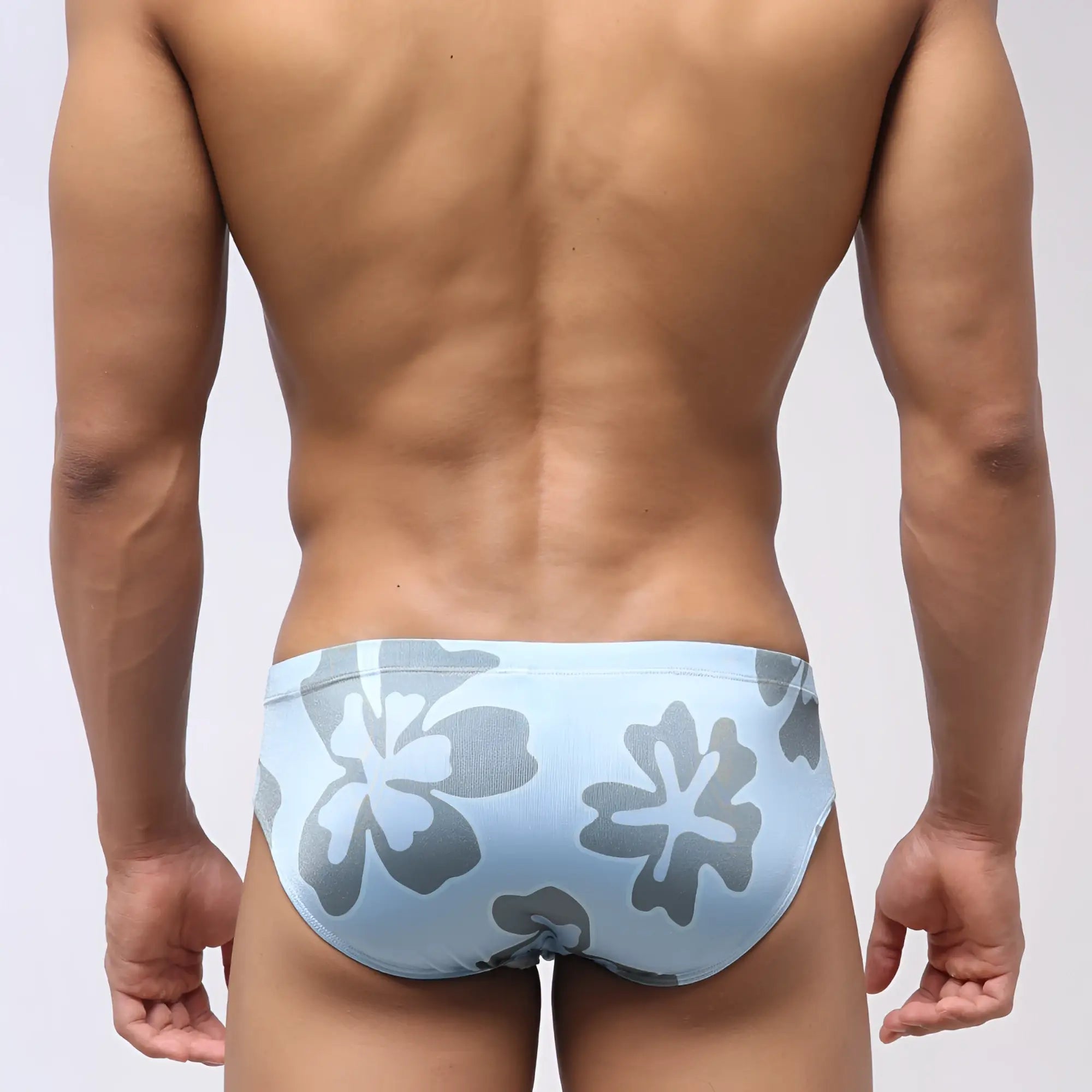 Light blue MetroMaleWear Vasco swim brief with gray and white floral pattern designed for beach and pool use