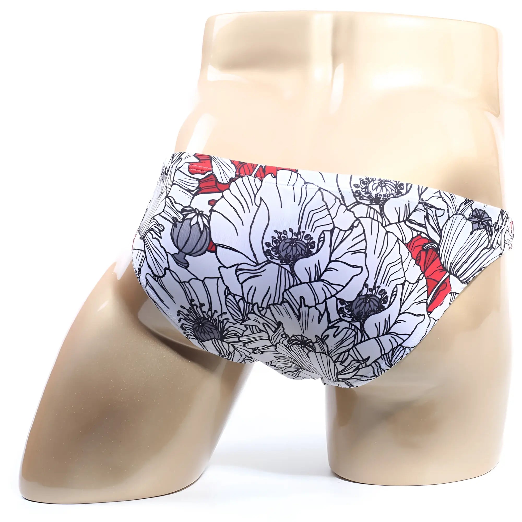 White swim trunks metroMalewear vendeta bikini blossom 2614-09 with bold floral pattern black outlines red accents
