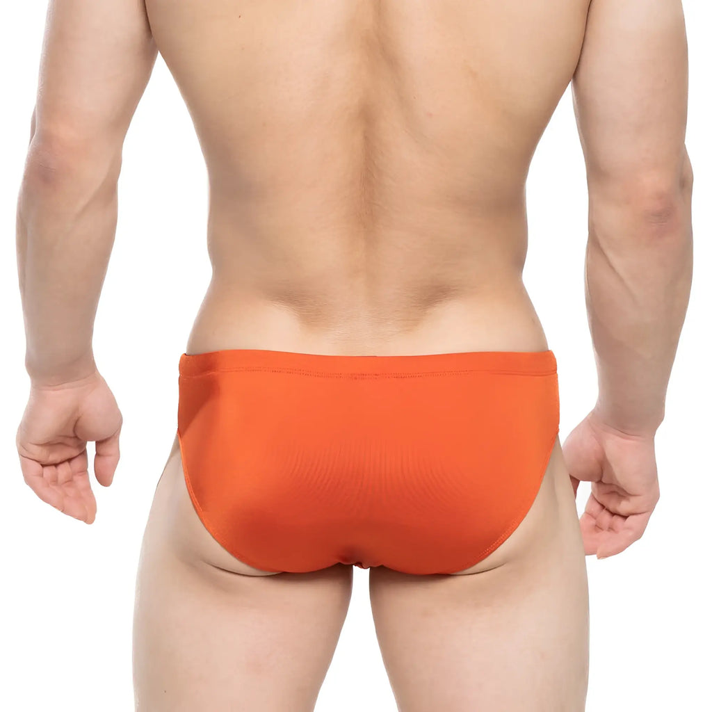 Bright orange ochre swim briefs by MetroMaleWear made of smooth stretchy fabric for comfortable wear