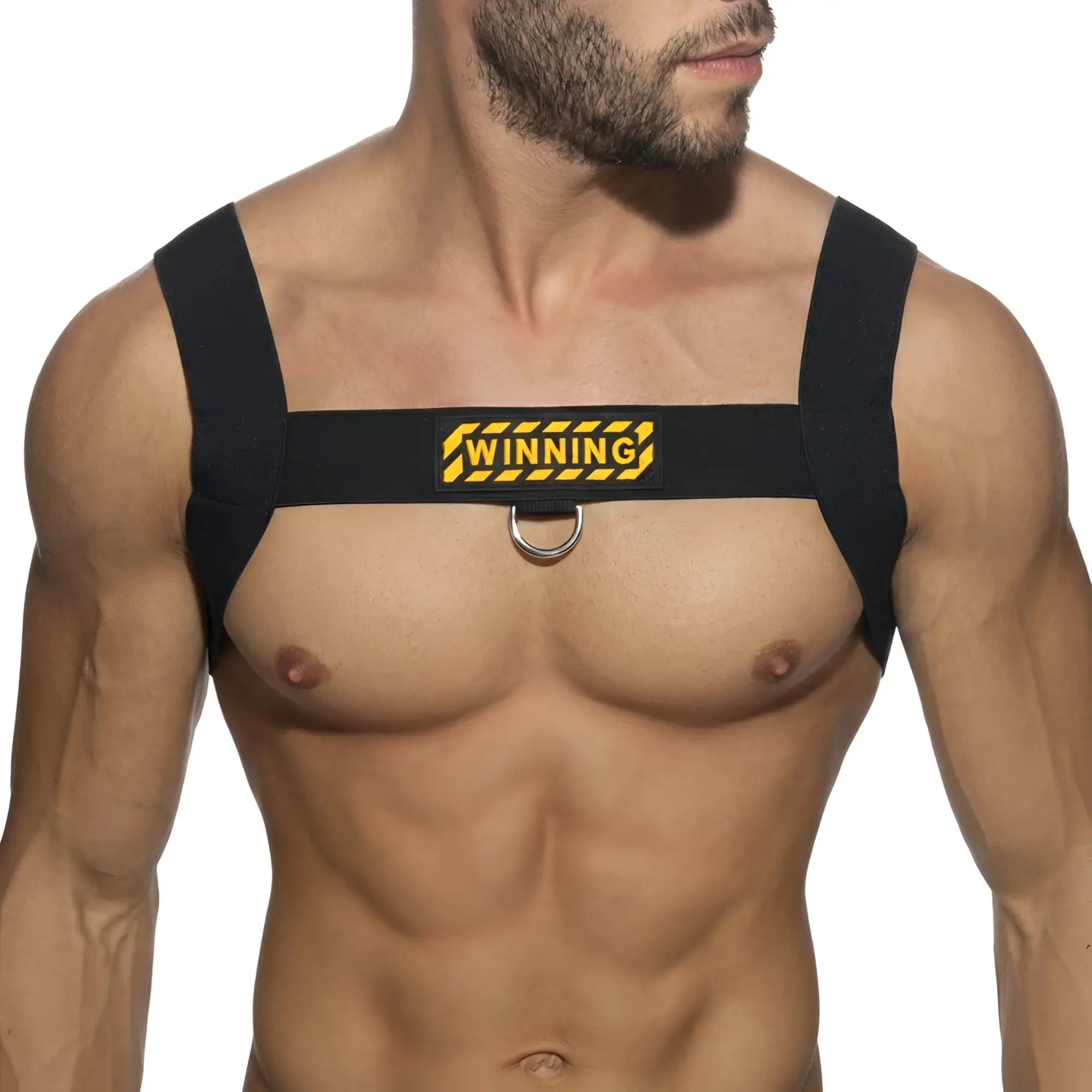 Black fabric shoulder harness with yellow and black winning logo patch and central silver metal ring by metromalewear