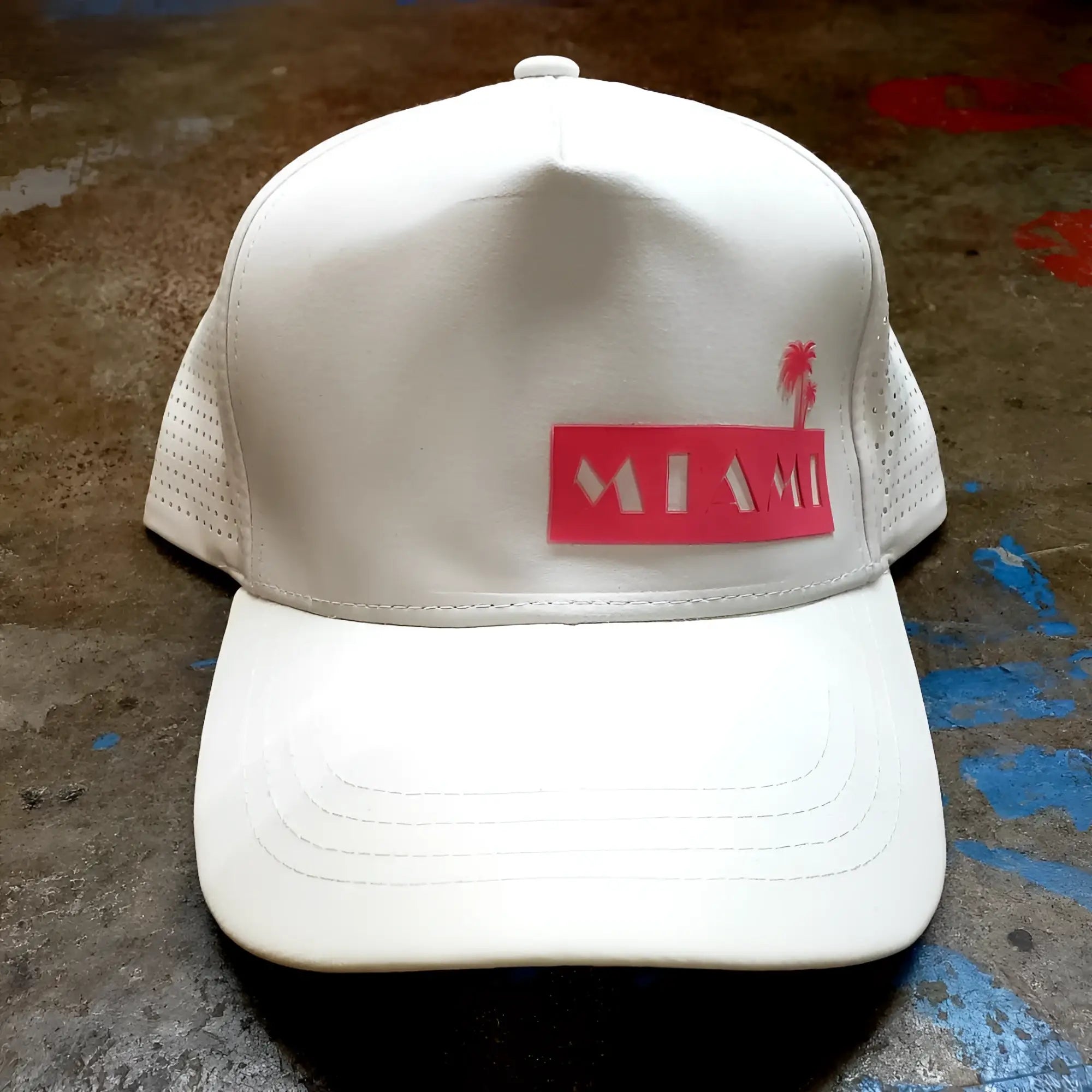White trucker miami baseball cap with red patch featuring palm tree silhouette and embroidered miami text