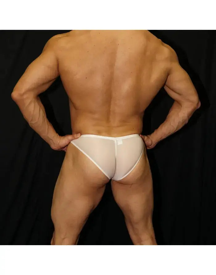Cream micro bikini underwear by Arroyman featuring a sheer design and minimal coverage shown on a model from the back.
