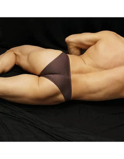 Brown micro fabric men's underwear by Arroyman featuring a snug fit and minimal coverage shown on a model.
