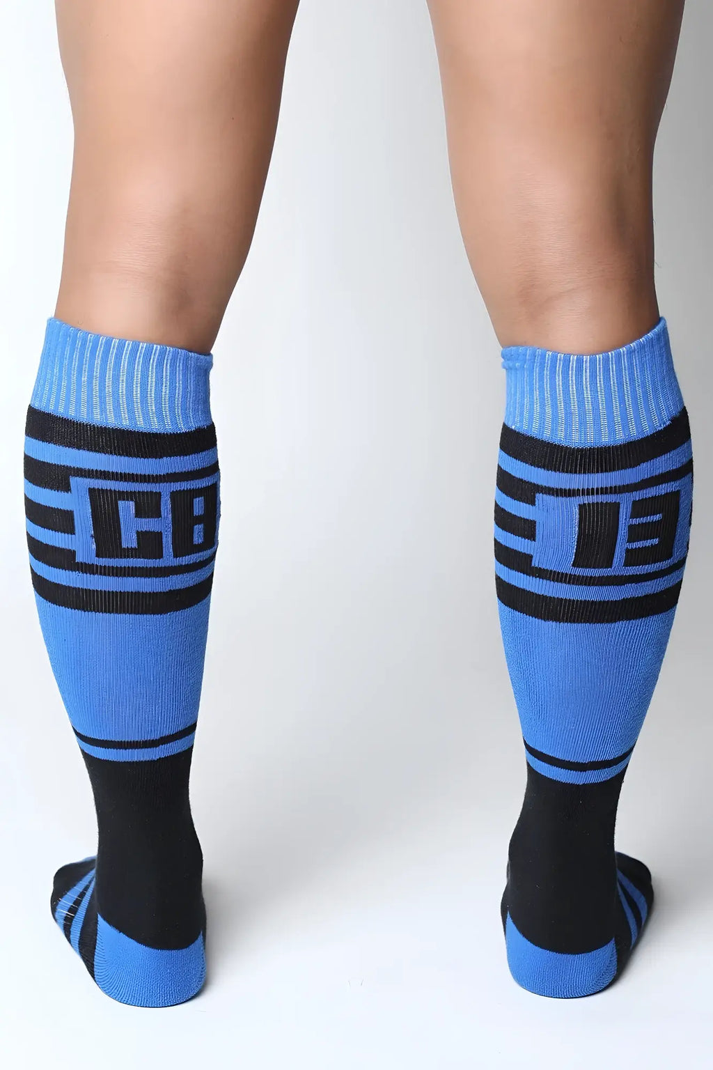 Blue and black midfield knee high athletic socks with bold cb logo design for sports and training use