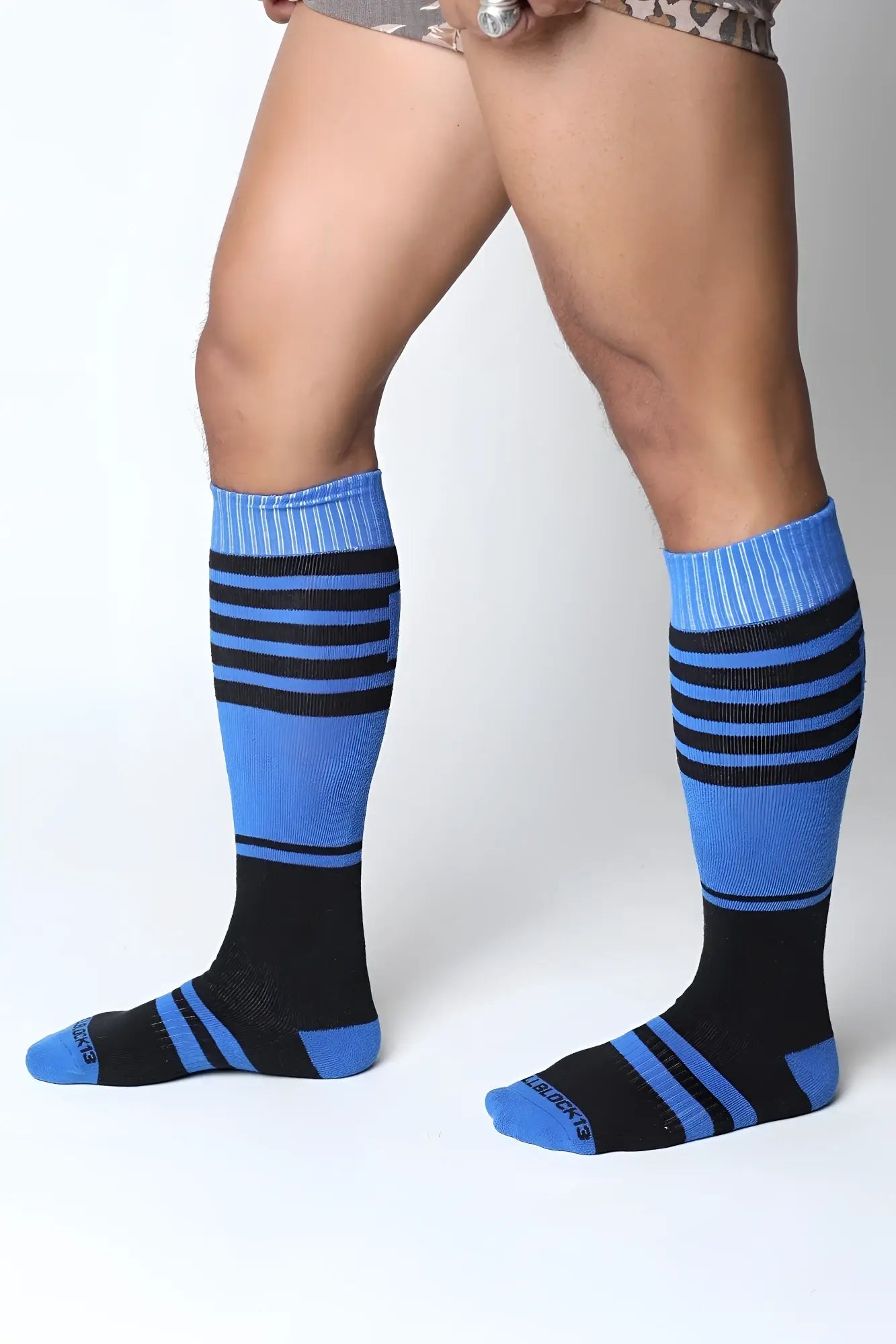 Blue and black striped midfield knee high socks with ribbed cuffs in seven colors for casual and athletic wear