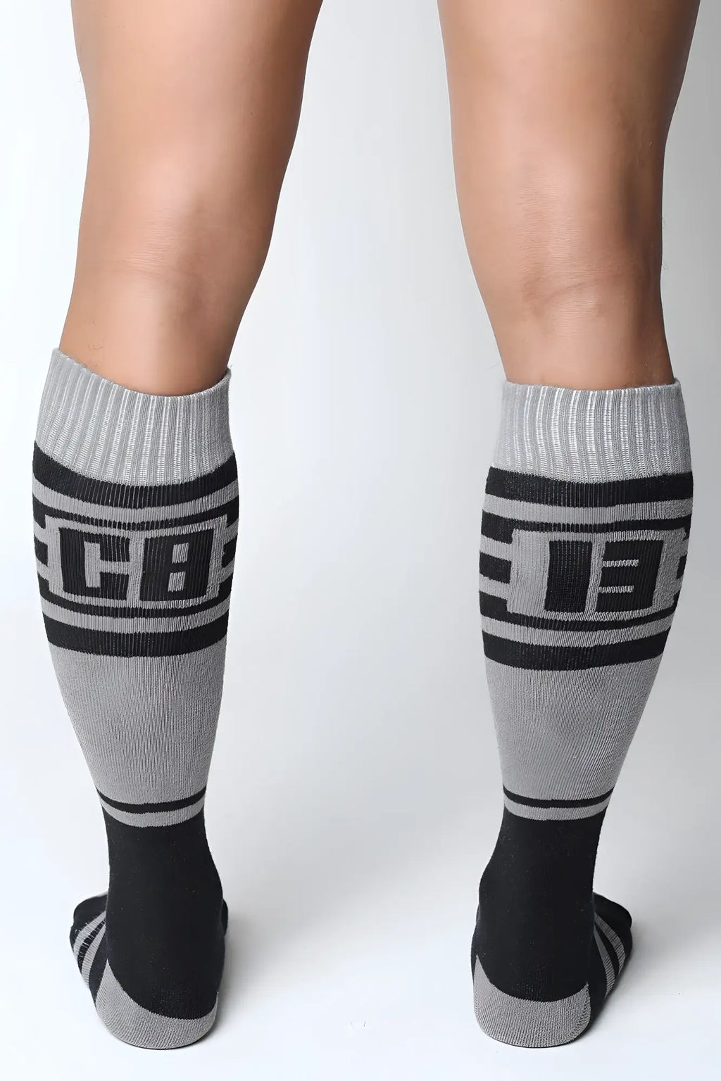 Midfield knee high socks in gray and black with bold cb lettering and ribbed cuffs for athletic use