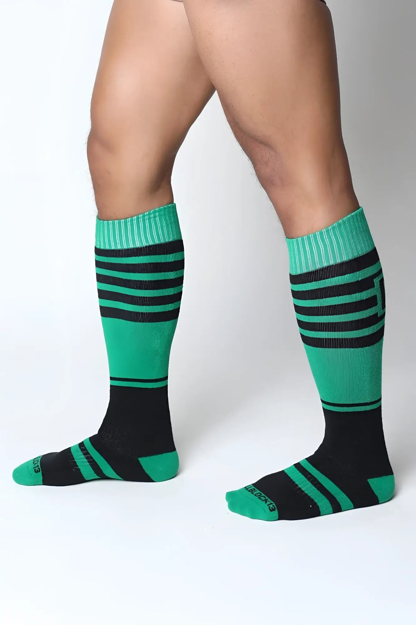 Midfield knee high sock with green and black stripes and ribbed cuffs made for comfortable wear
