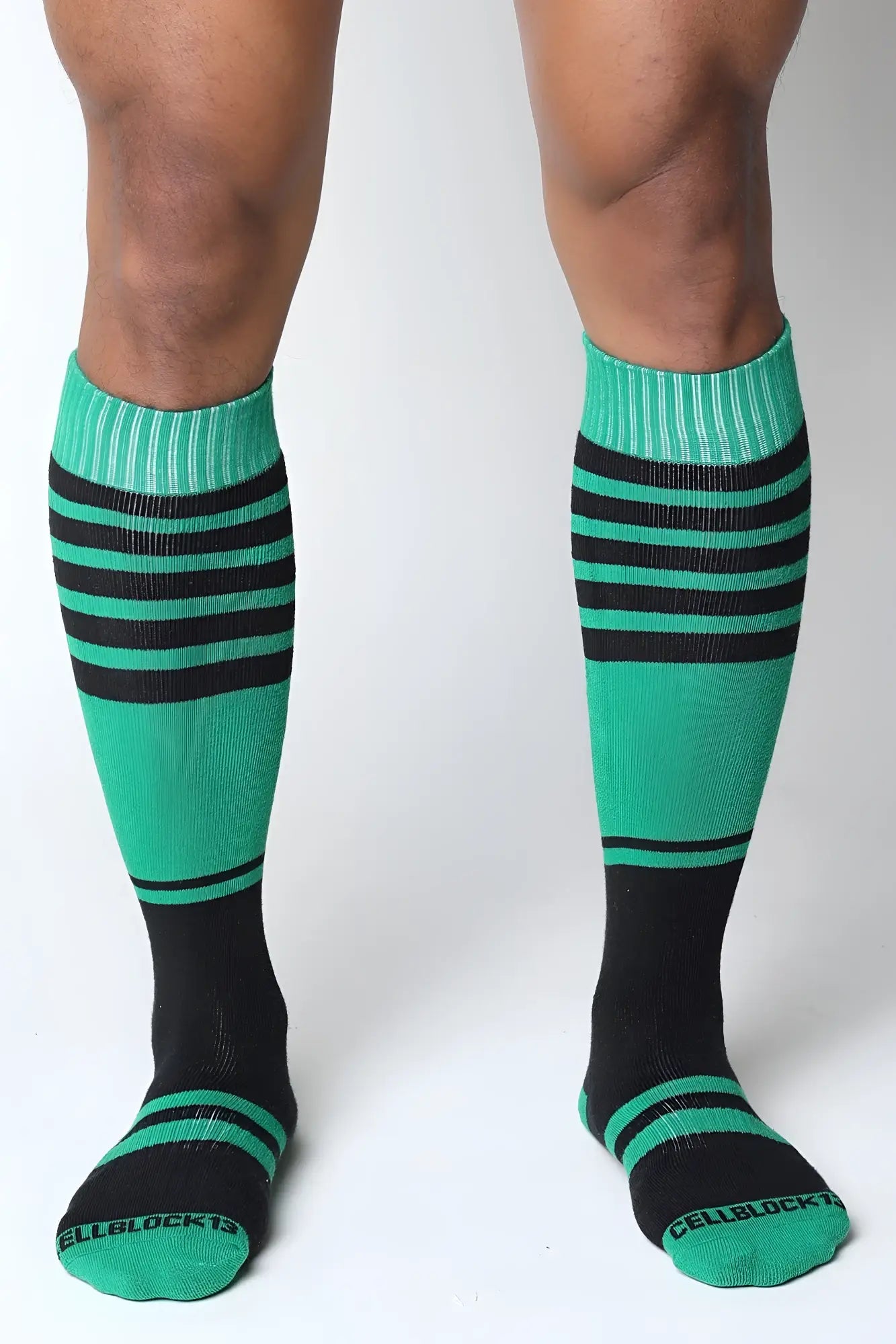 Midfield knee high socks in vibrant teal and black stripes with ribbed cuffs and cellblock brand on the toe