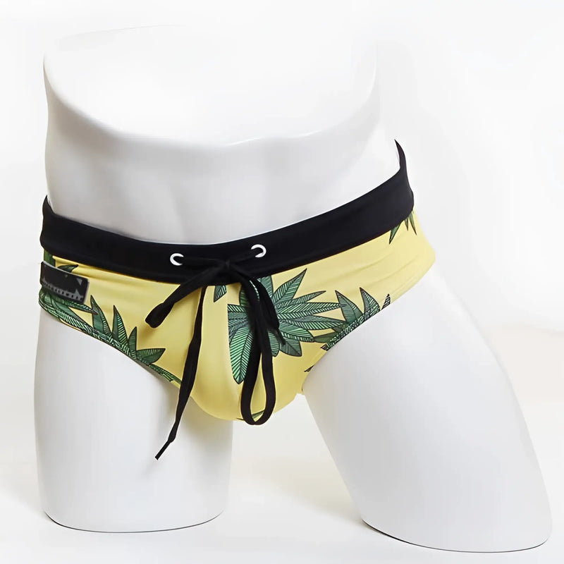 Yellow MIIW floral beach bikini swimwear swim trunks with green leaf pattern and black elastic waistband size S