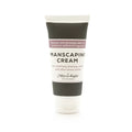 A sleek black and white tube of Mixologie manscaping cream shave lotion sent IV with minimalist label and elegant typography