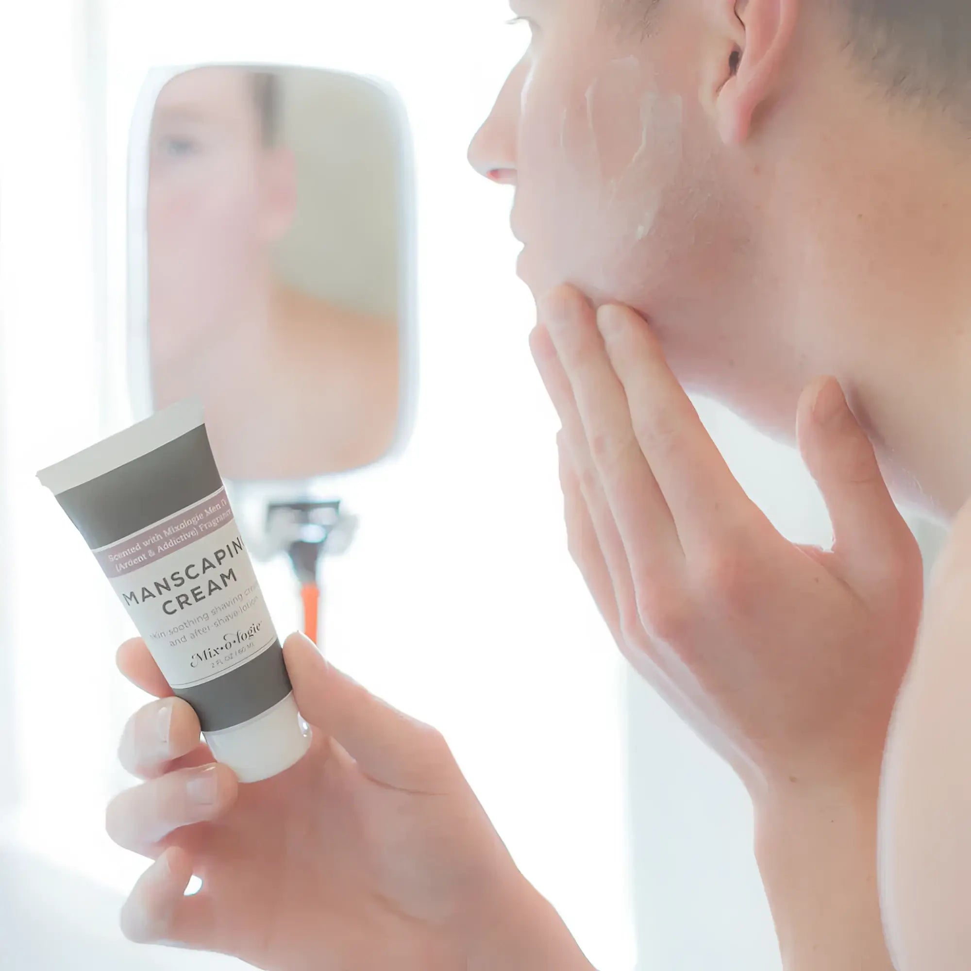 A sleek matte gray tube of Vichy Mixologie manscaping cream shave lotion sent iv with a white cap and minimalist label
