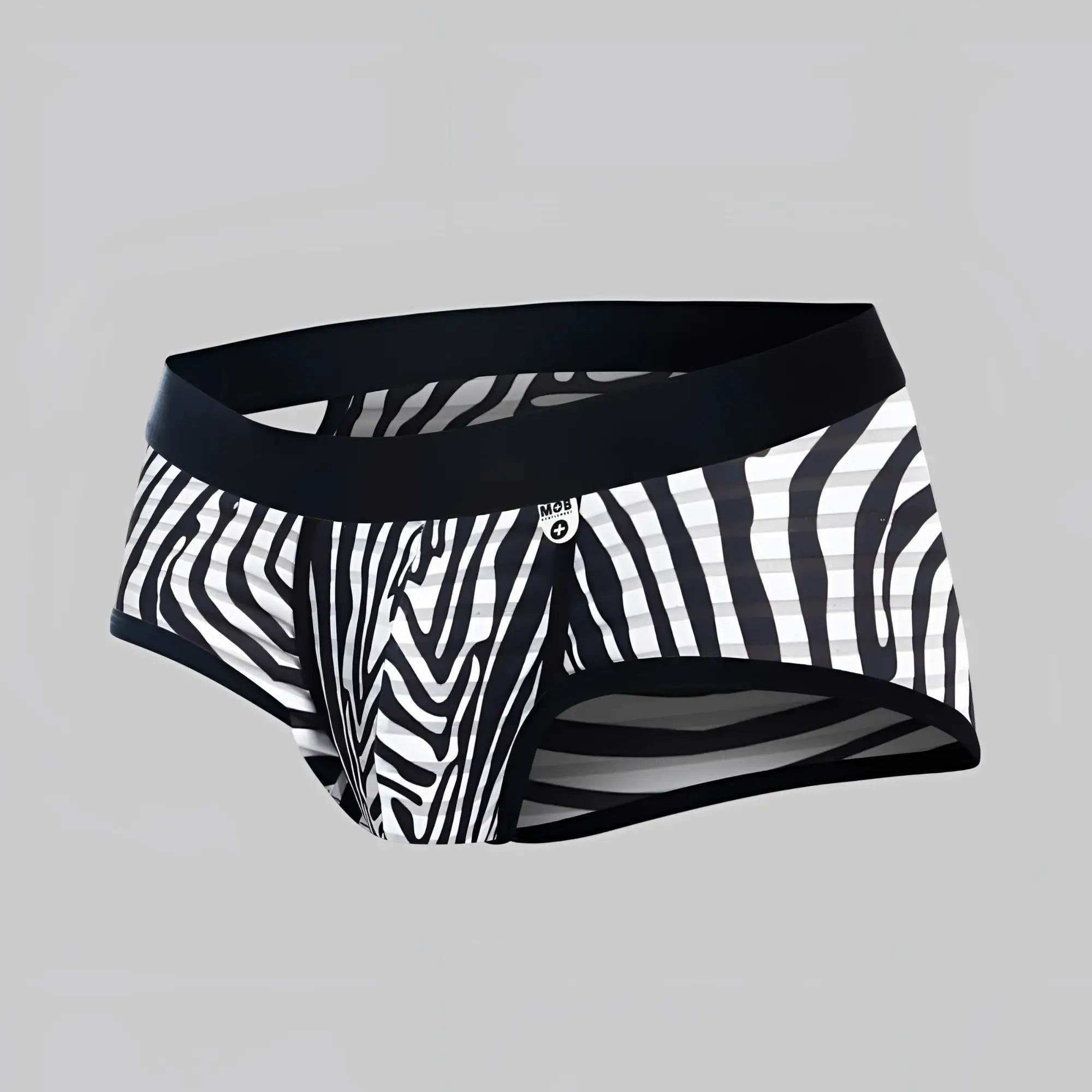 Black and white zebra-striped men’s briefs with solid black waistband from mob aero brief collection