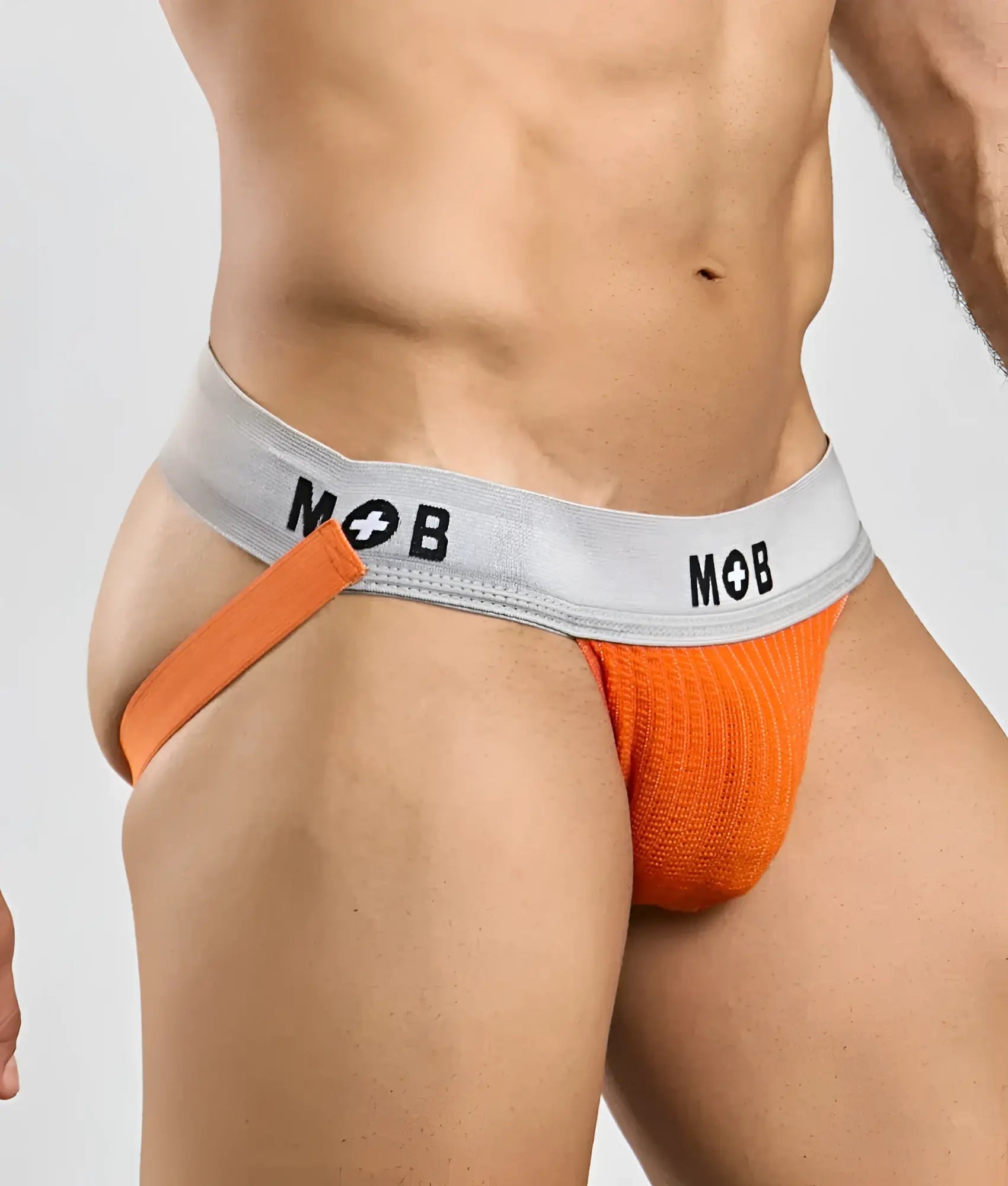Orange knitted briefs with a gray waistband featuring mob logo in black from mob classic jock 3 inches collection