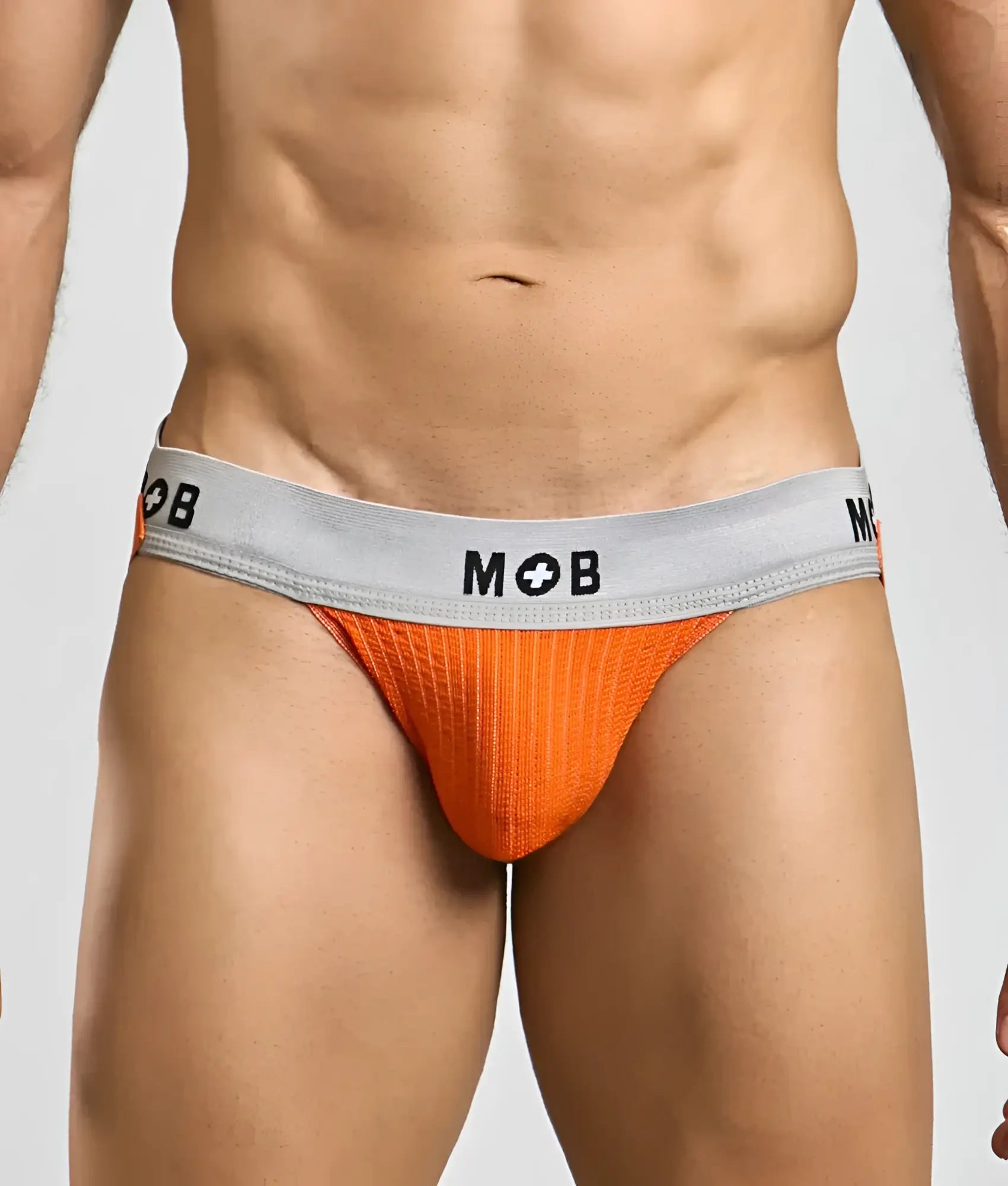 Orange textured briefs with a gray waistband featuring the mob logo from the mob classic jock 3 inches collection