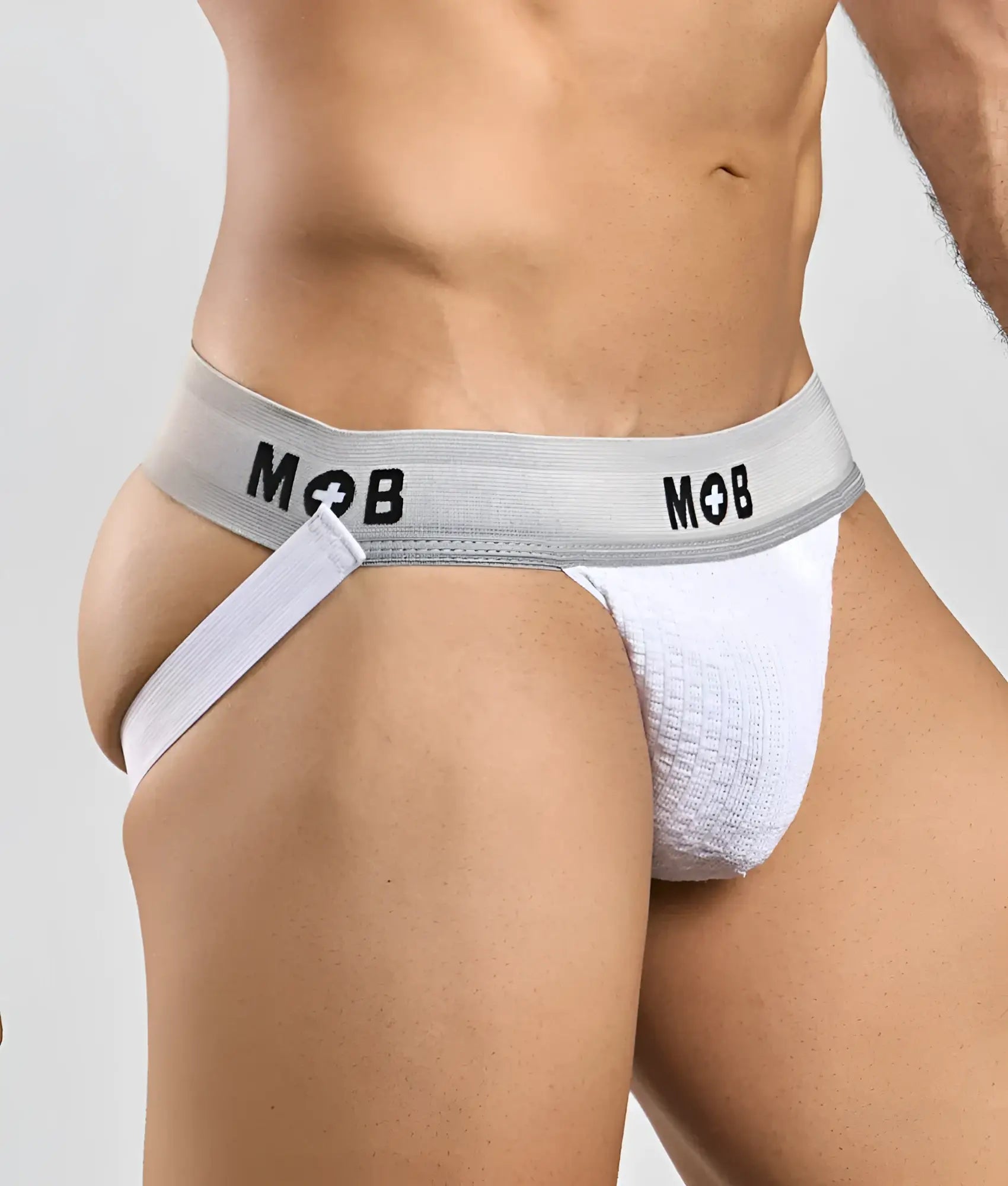 White textured jockstrap with gray elastic waistband and black mob branding in mob classic jock 3 inches design