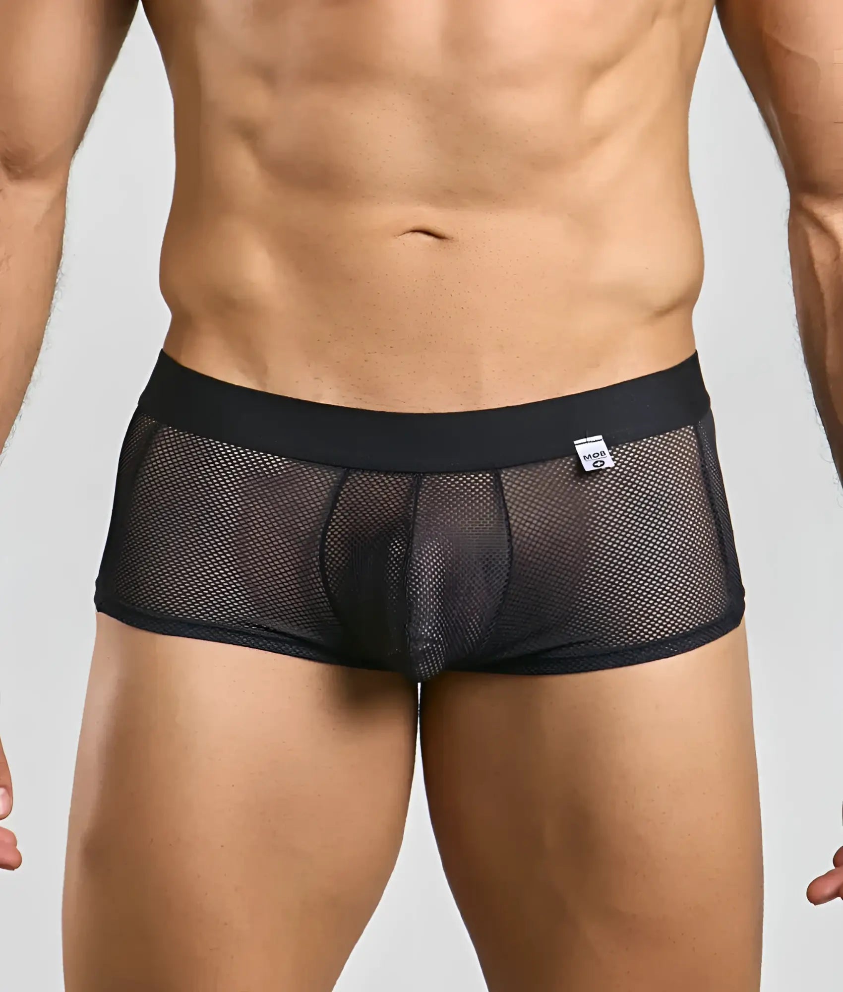 Mob fishnet boxer black mesh briefs with solid waistband and small white brand tag visible in front view