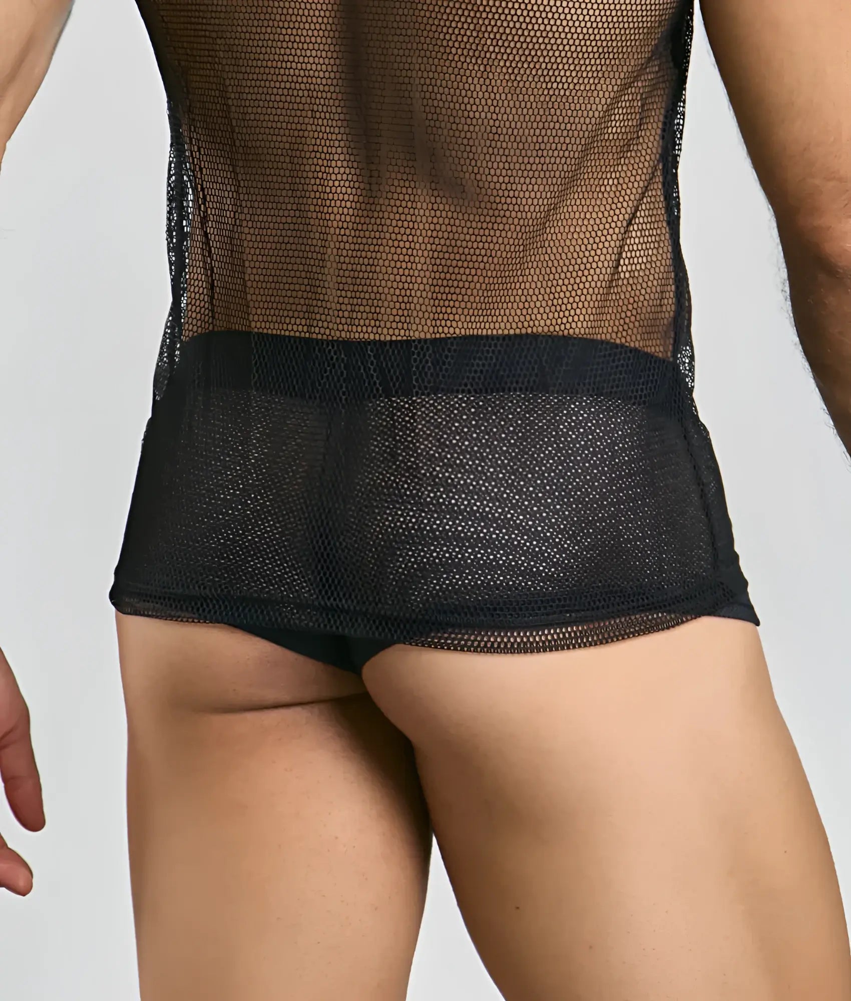 Black mesh tanktop with solid black waistband featuring breathable fishnet material for stylish layering