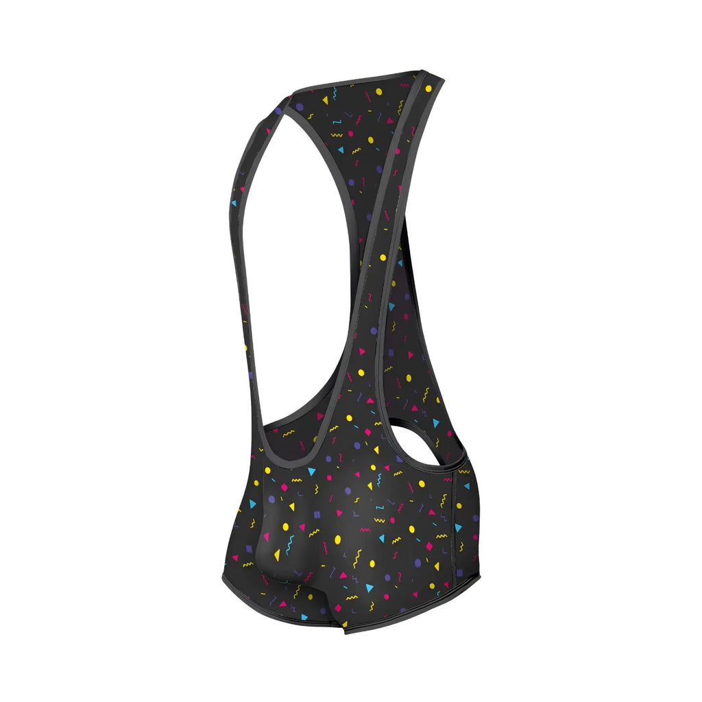 Black cycling bib shorts with vibrant yellow pink blue and purple confetti pattern featuring geometric shapes from mob singlet