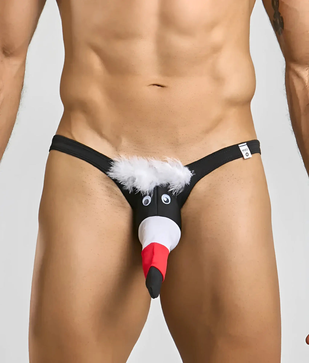 Black novelty thong featuring a cartoon penguin design with white fluffy trim and googly eyes for men
