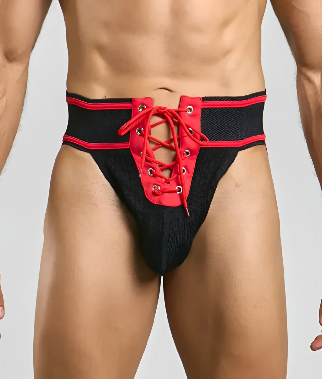 Mob football jockstrap in black and red with lace-up design and textured fabric waistband front view