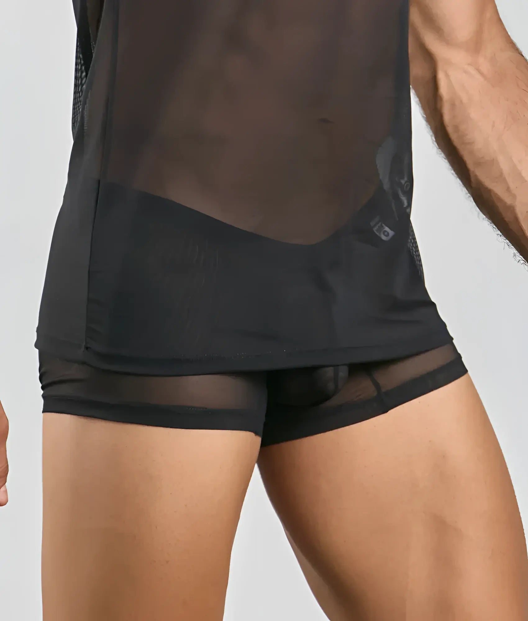 Black mesh athletic shorts with sheer form-fitting design and reinforced waistband shown from the back for activewear use